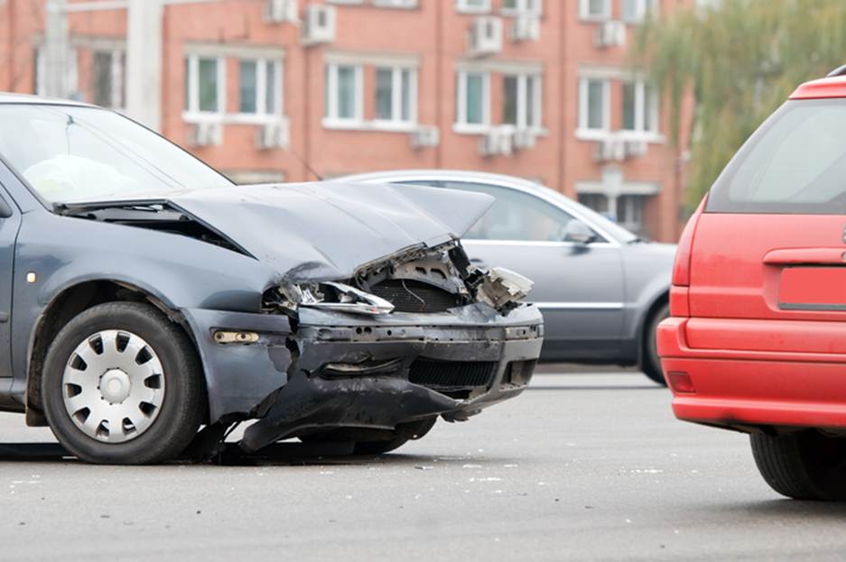 A damaged car on the road
AI-generated content may be incorrect.